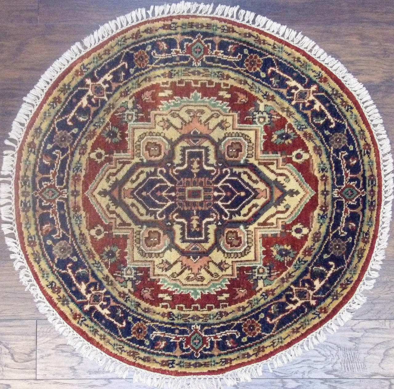 Tribal Heriz hand-knotted wool round rug in blue and red, full view