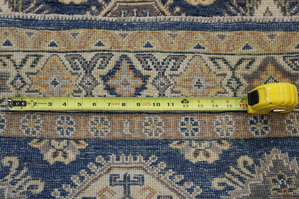 Blue Tribal Super Kazak rug in room setting