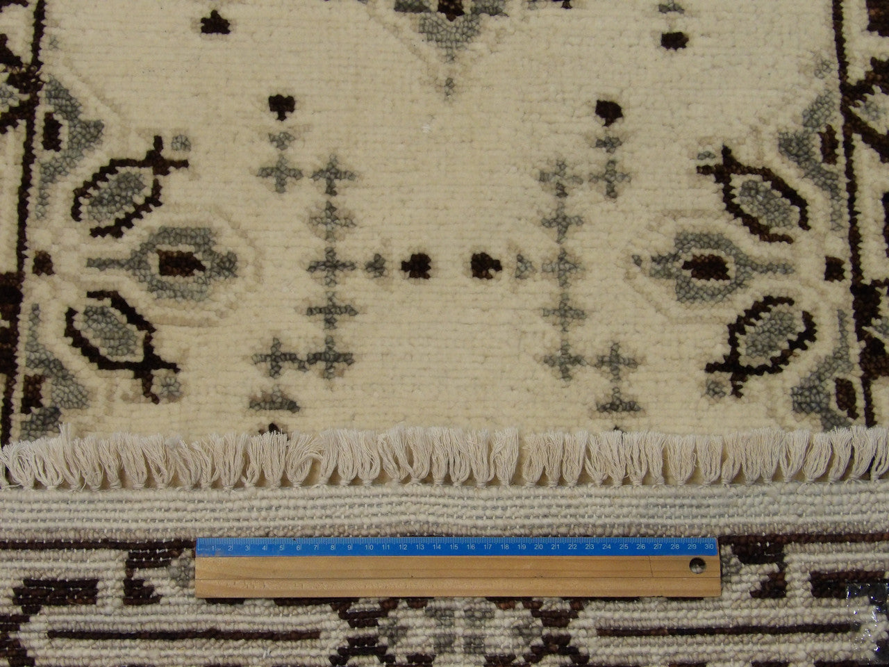 Brown and ivory Serapi runner in hallway setting
