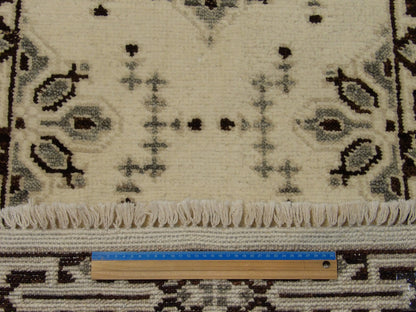 Brown and ivory Serapi runner in hallway setting
