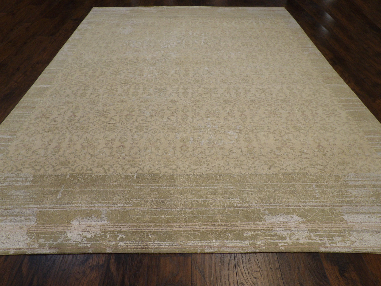 Close-up of wool-silk pile, gold and green rug