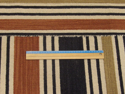 Black and brown coastal rug in room setting
