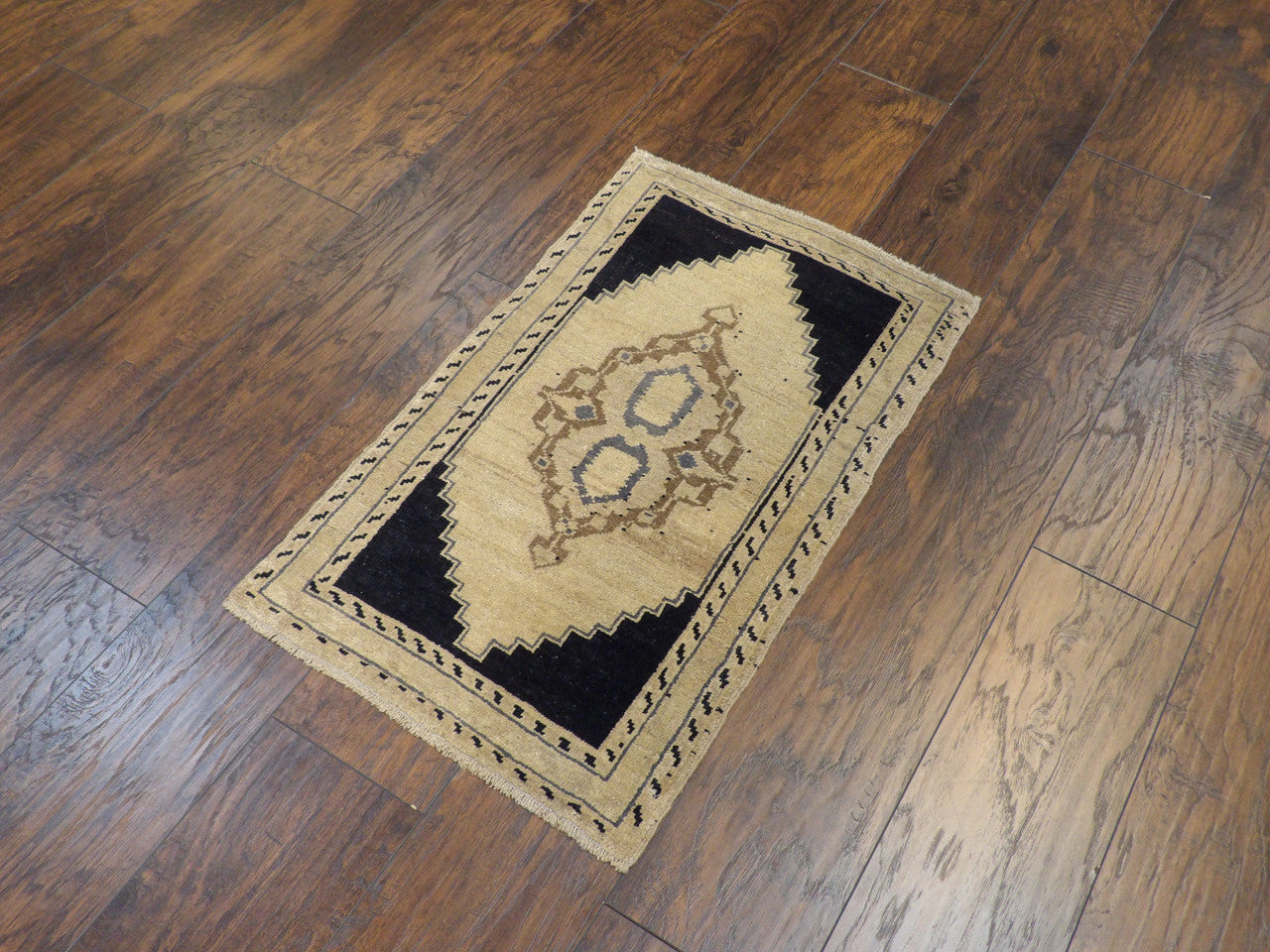 Yastik pattern detail, antique beige and black hand-knotted rug