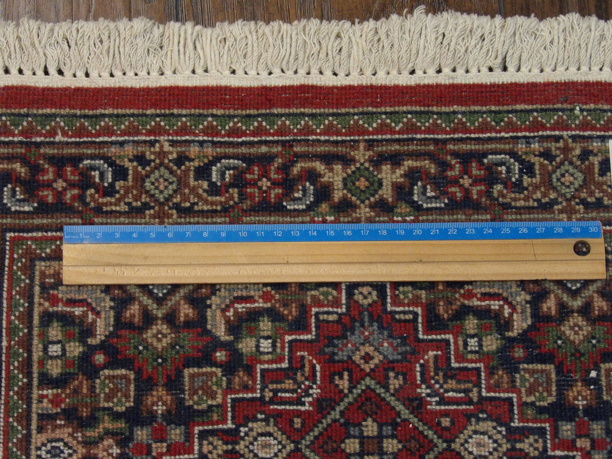 Blue & Red Fine Persian Bidjar rug in room setting