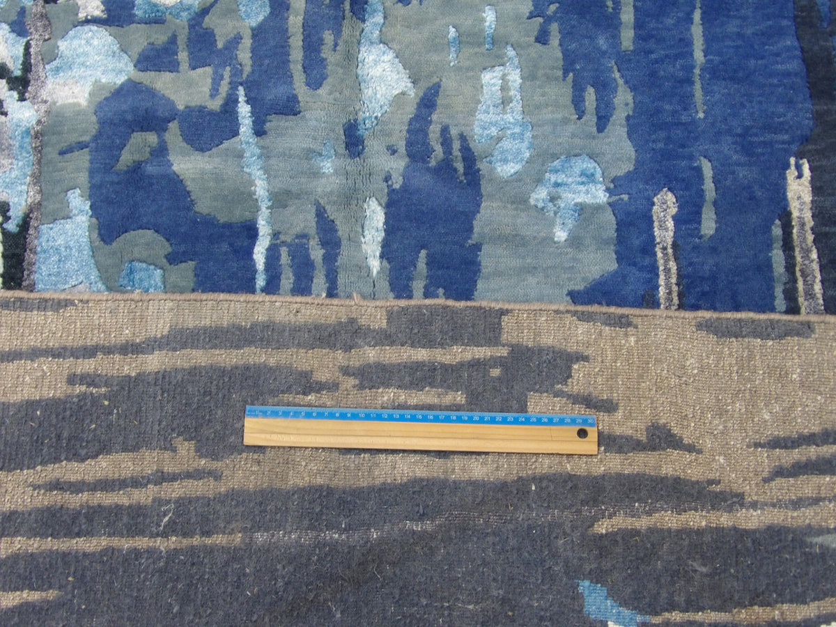 Full room view of oversized Modern Monsoon hand-knotted rug