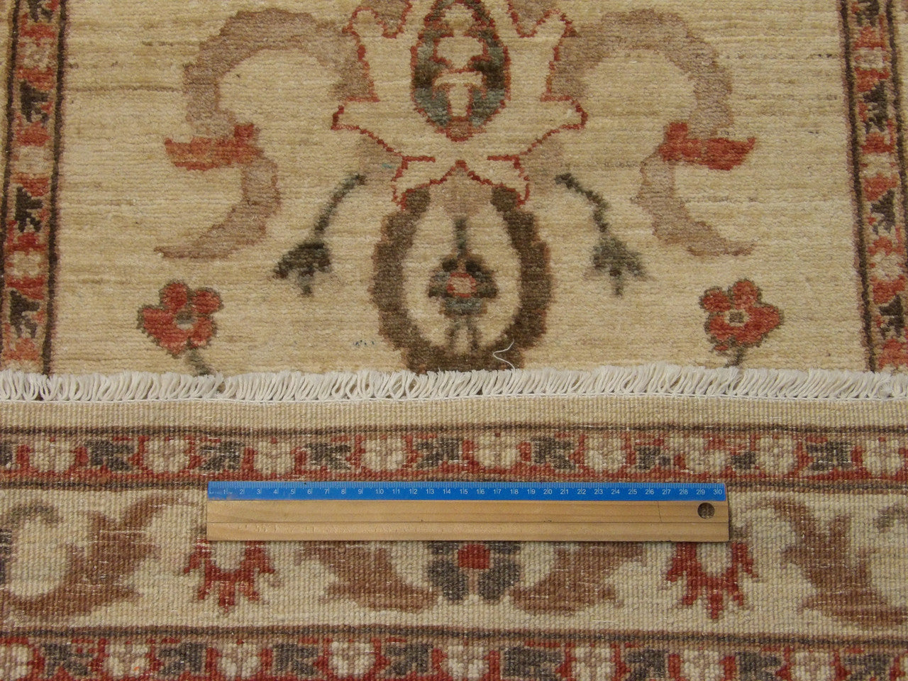 Beige Oushak runner in hallway setting