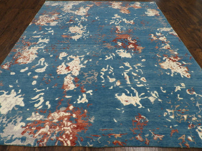 Close-up of wool-silk pile, rust and teal rug