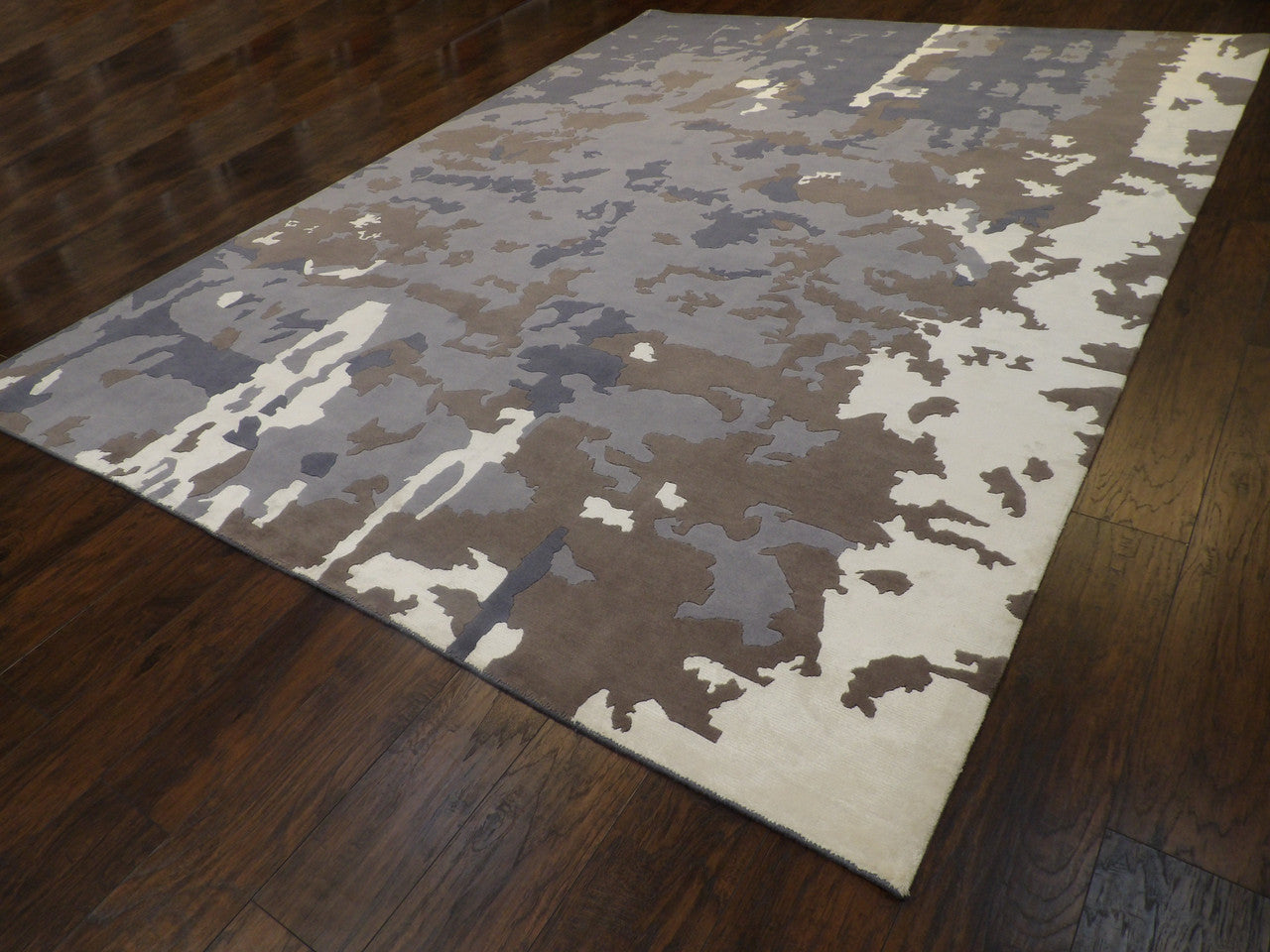Blue and white marble-design rug in a formal living room setting