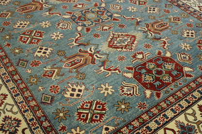 Blue & Beige Tribal Super Kazak rug in room setting