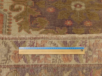 Pink and purple Oushak rug in room setting