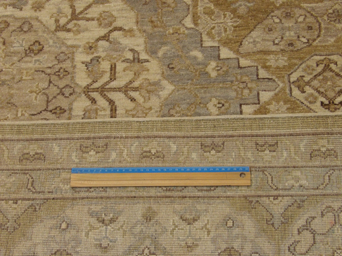 Gold and gray Khotan rug in room setting