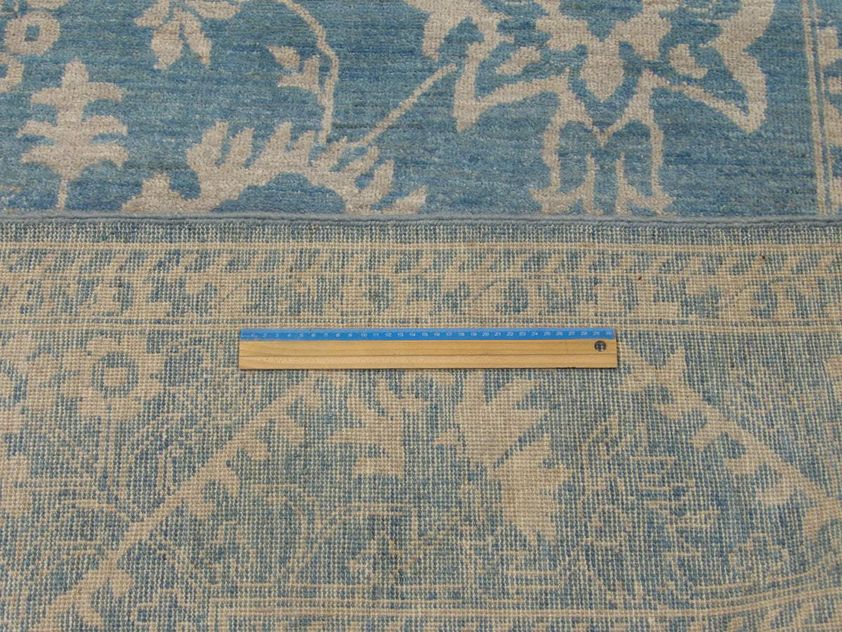 Full room view of Oushak Chobie hand-knotted rug