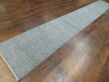 Blue stone wash runner in a long hallway setting