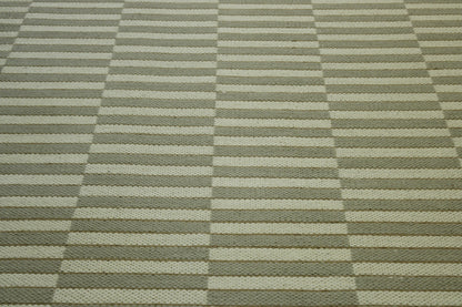 Close-up of wool pile, Green & Beige rug