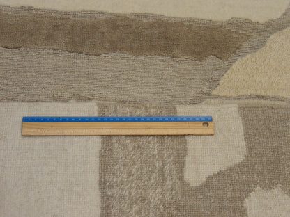 Gold and beige Tibetan rug in room setting