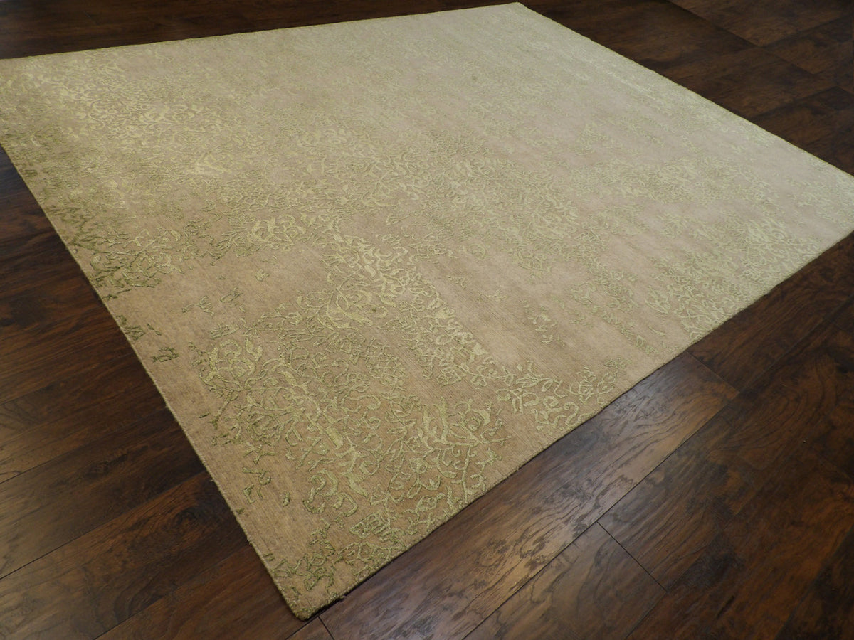 Green and gray transitional rug in a living room setting