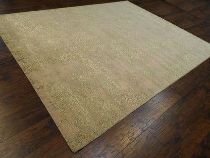 Green and gray transitional rug in a living room setting