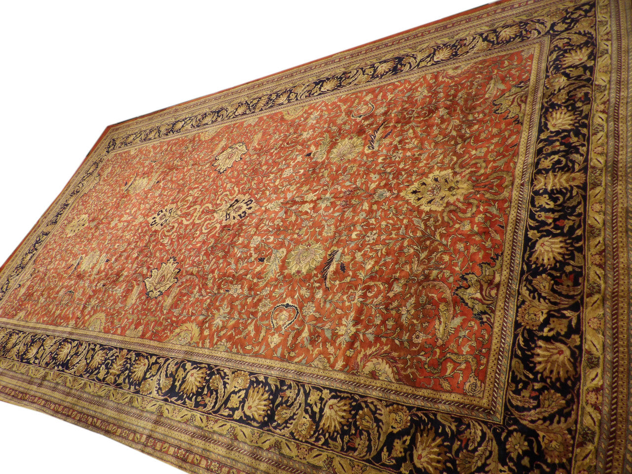 Palatial blue and red Persian rug in a grand room setting
