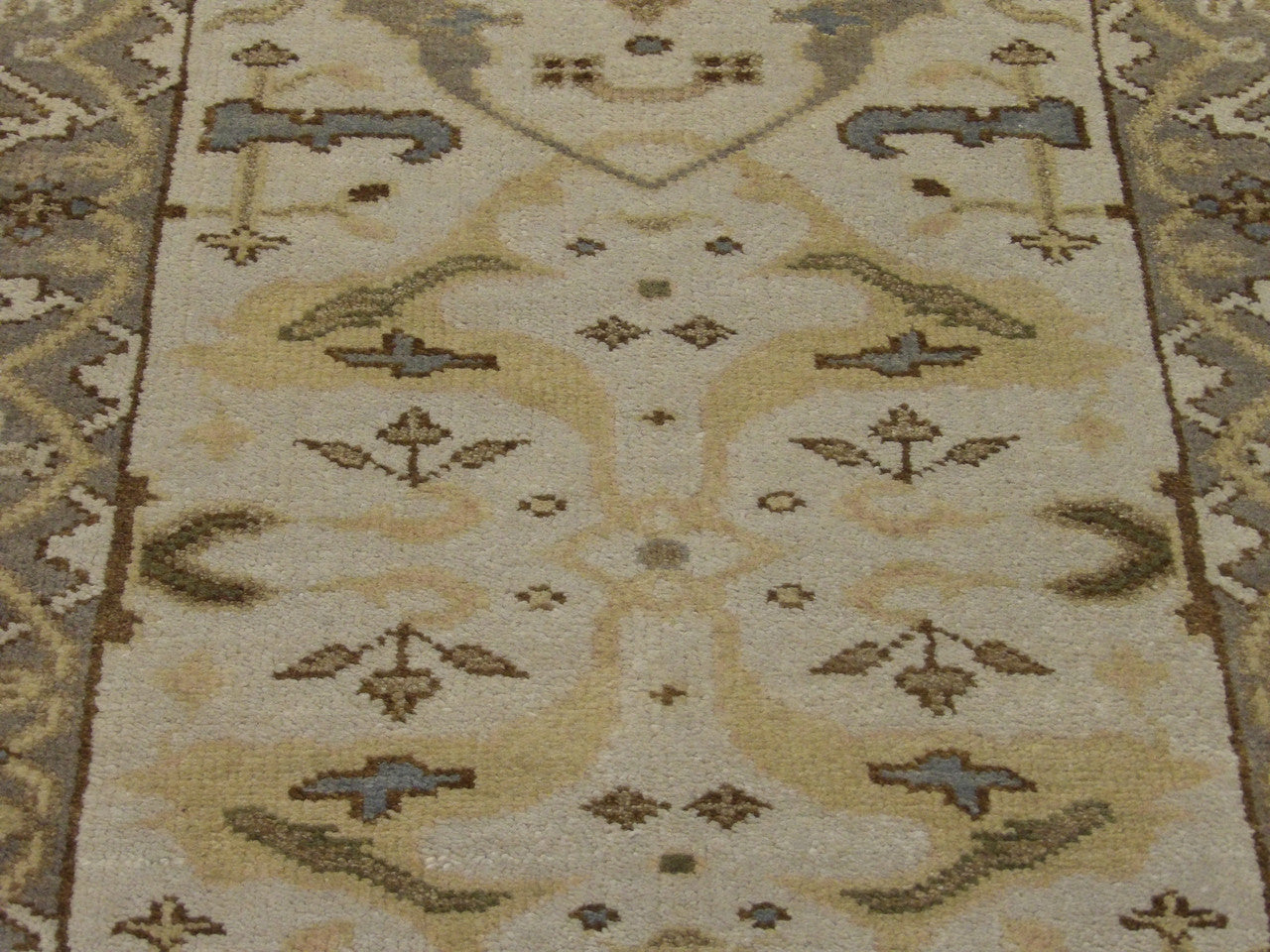 Oushak wool texture close-up, beige and gray
