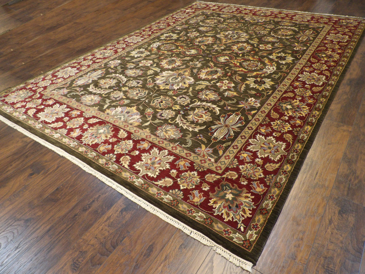 Kashan medallion pattern detail, green and red wool-silk rug