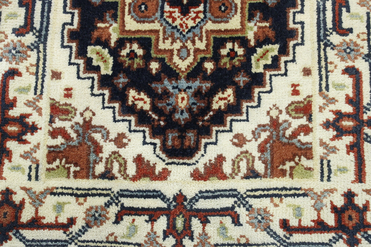 Tribal Heriz rug corner detail