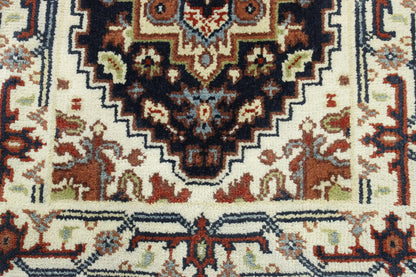 Tribal Heriz rug corner detail