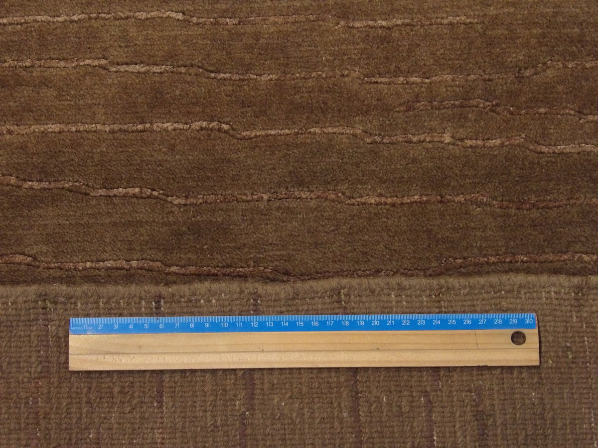 Brown plain modern rug in room setting