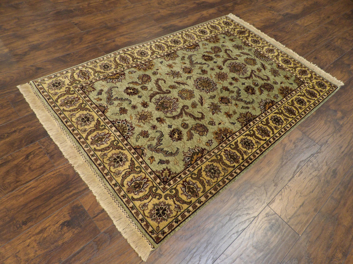 Kashan medallion pattern detail, gold and green tie-dye rug