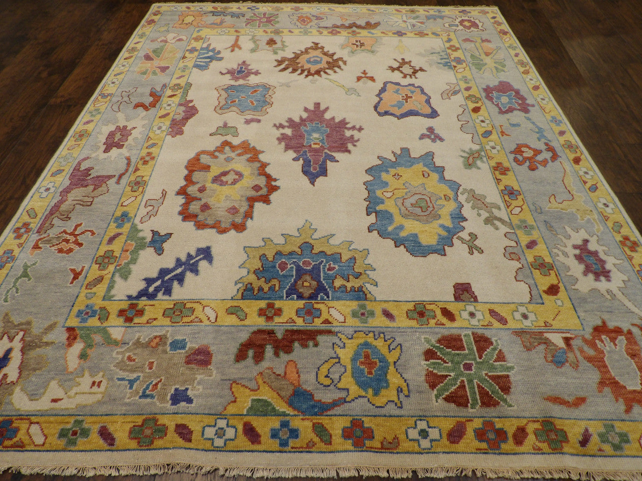 Back of hand-knotted colorful Oushak rug showing construction
