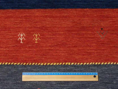 Multi-Color, Red & Blue Modern Gabbeh rug in room setting