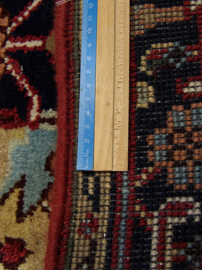 Blue & Red Persian Heriz rug in room setting