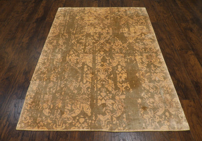 Close-up of wool-silk pile, gold and beige rug