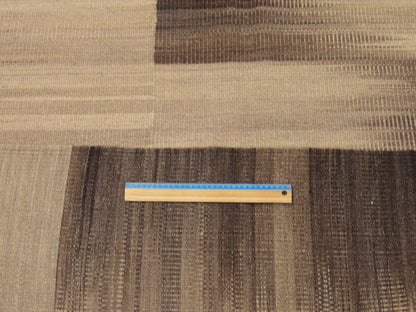 Black and beige coastal rug in room setting