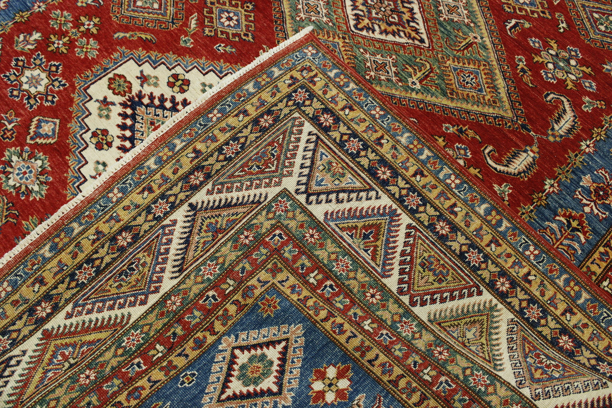 Red, Ivory, Rust & Beige Tribal Super Kazak rug in room setting