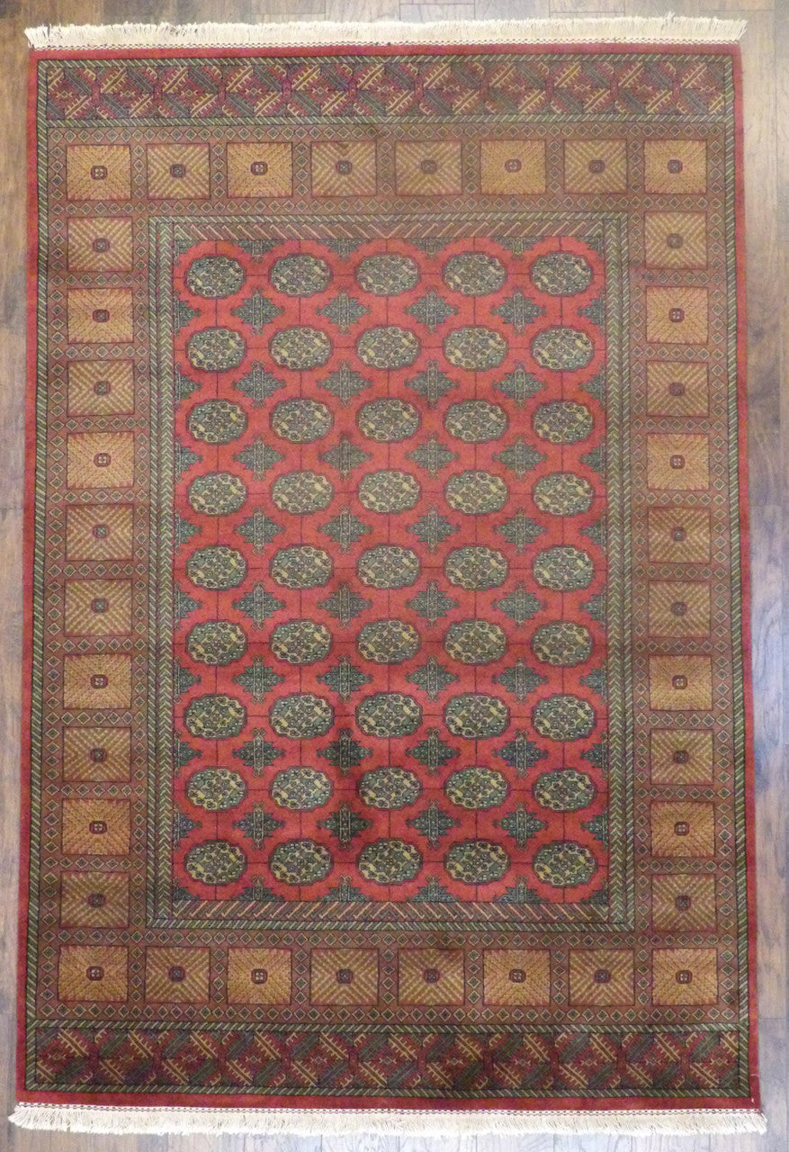 Tribal Bokhara Elephant Foot Design hand-knotted wool rug in Gold & Red, full view