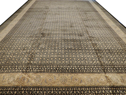 Close-up of wool-silk pile, black and beige rug