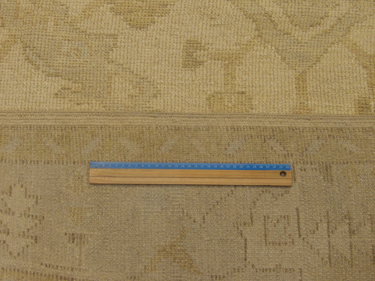 Blue and ivory Oushak rug in room setting