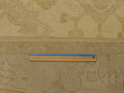 Blue and ivory Oushak rug in room setting