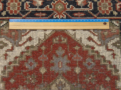 Black & Rust Tribal Heriz rug in room setting