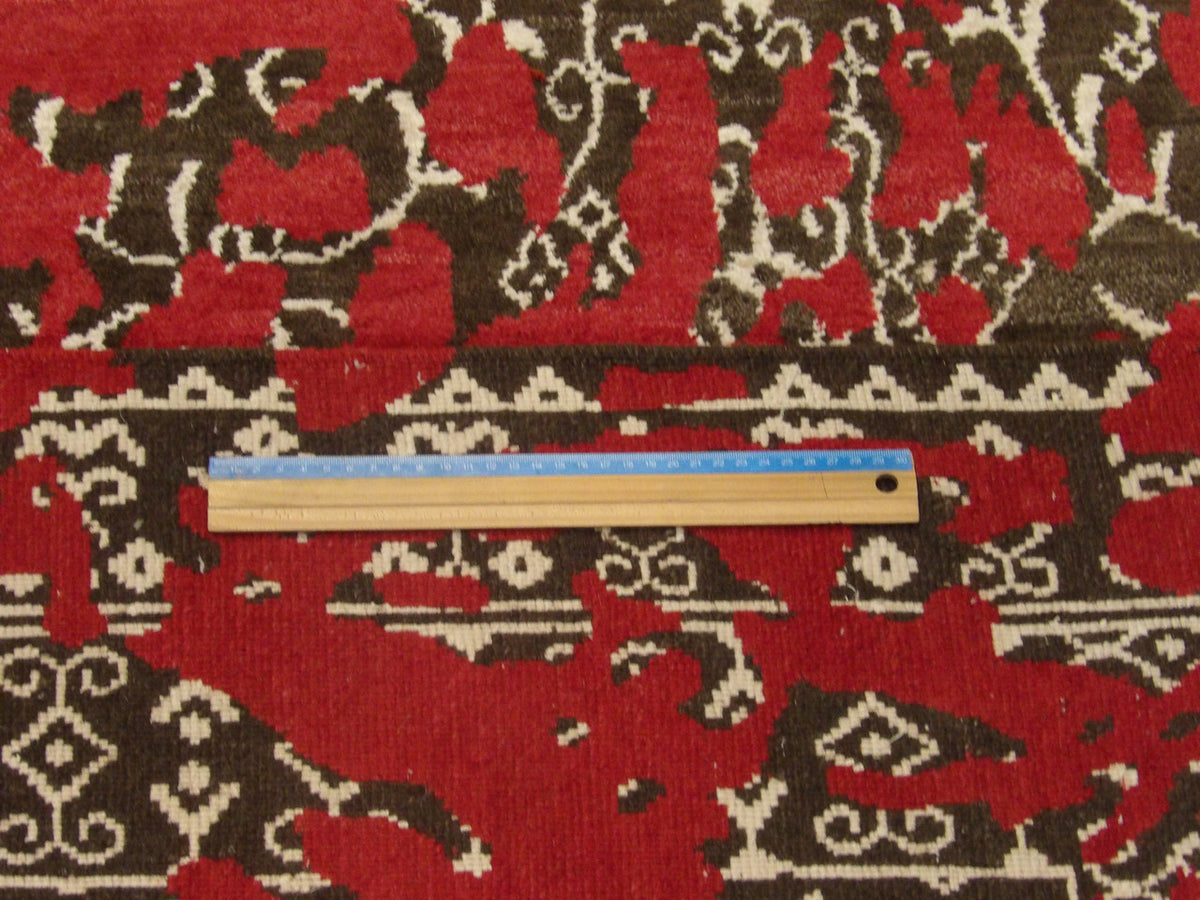 Brown and red transitional rug in room setting