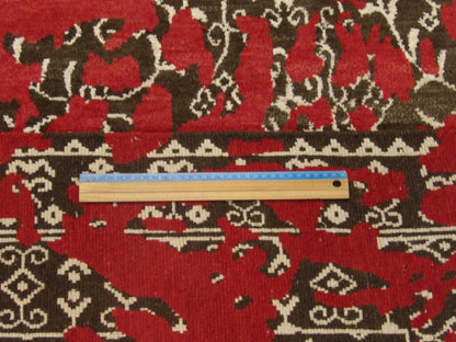 Brown and red transitional rug in room setting