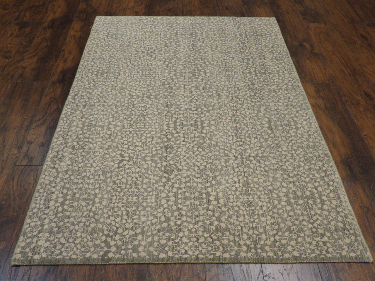 Close-up of wool pile, green rug