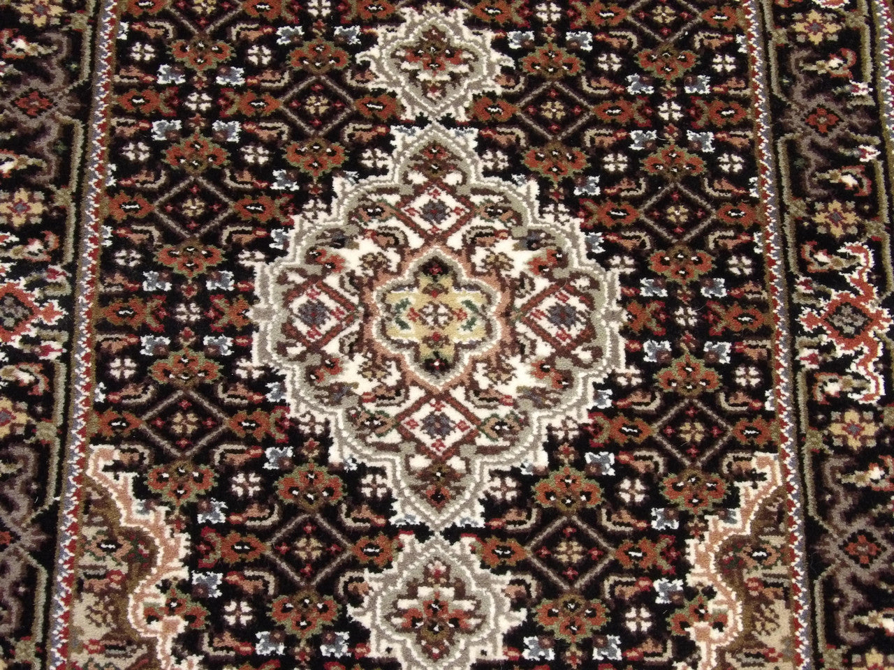 Back of Persian Mahi Tabriz hand-knotted rug