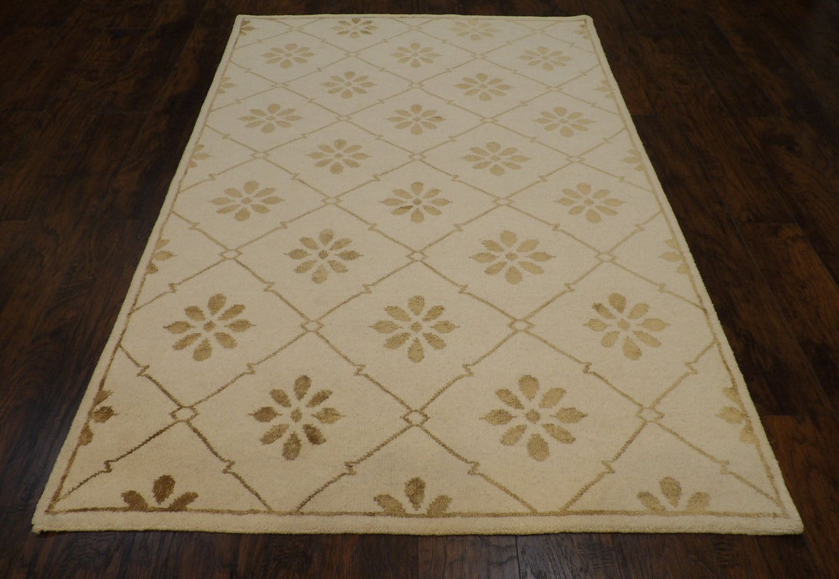 Close-up of wool pile, gold and ivory rug