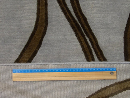 Blue and brown geometric rug in room setting