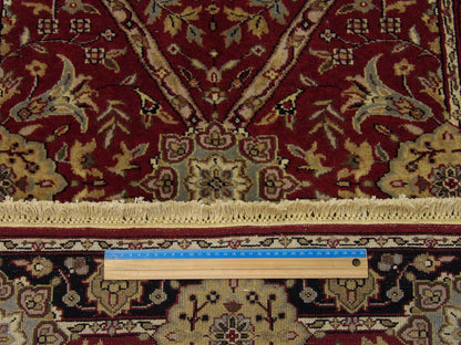 Black and red Tabriz runner in hallway setting