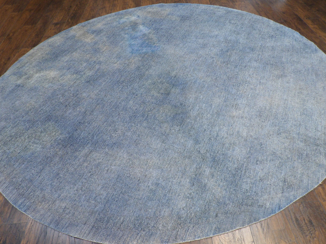 Close-up of wool pile, blue and gray round rug