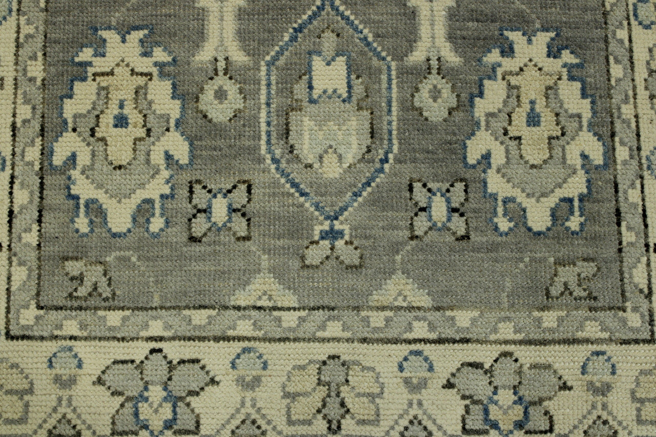 Gray & Beige Oushak Chobi rug in room setting