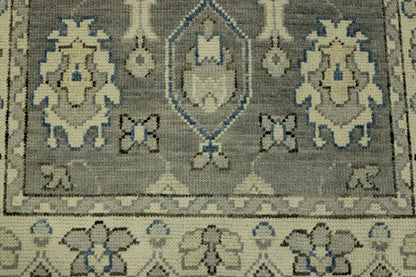 Gray & Beige Oushak Chobi rug in room setting