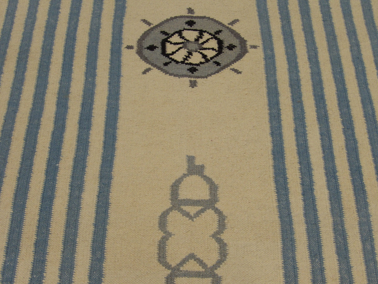 Coastal rug edge detail, blue and white flatweave